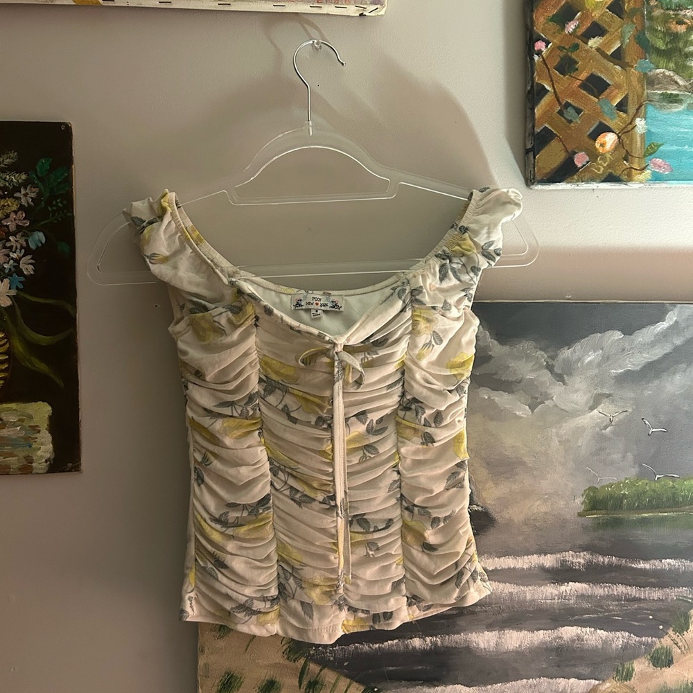 Off white ruffle top with yellow flowers